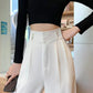 Schwarze weite Freizeithose mit Knopfdetails - Mia